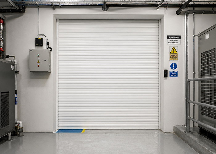 Compact roller shutter door at an equipment and utility room