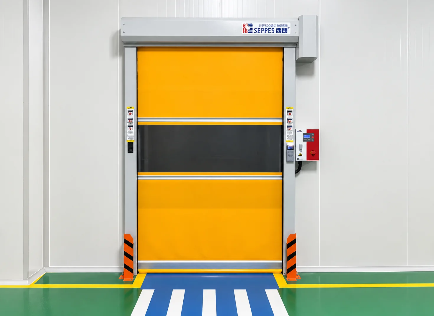 Yellow PVC roll-up doors with transparent vision panels inside a factory