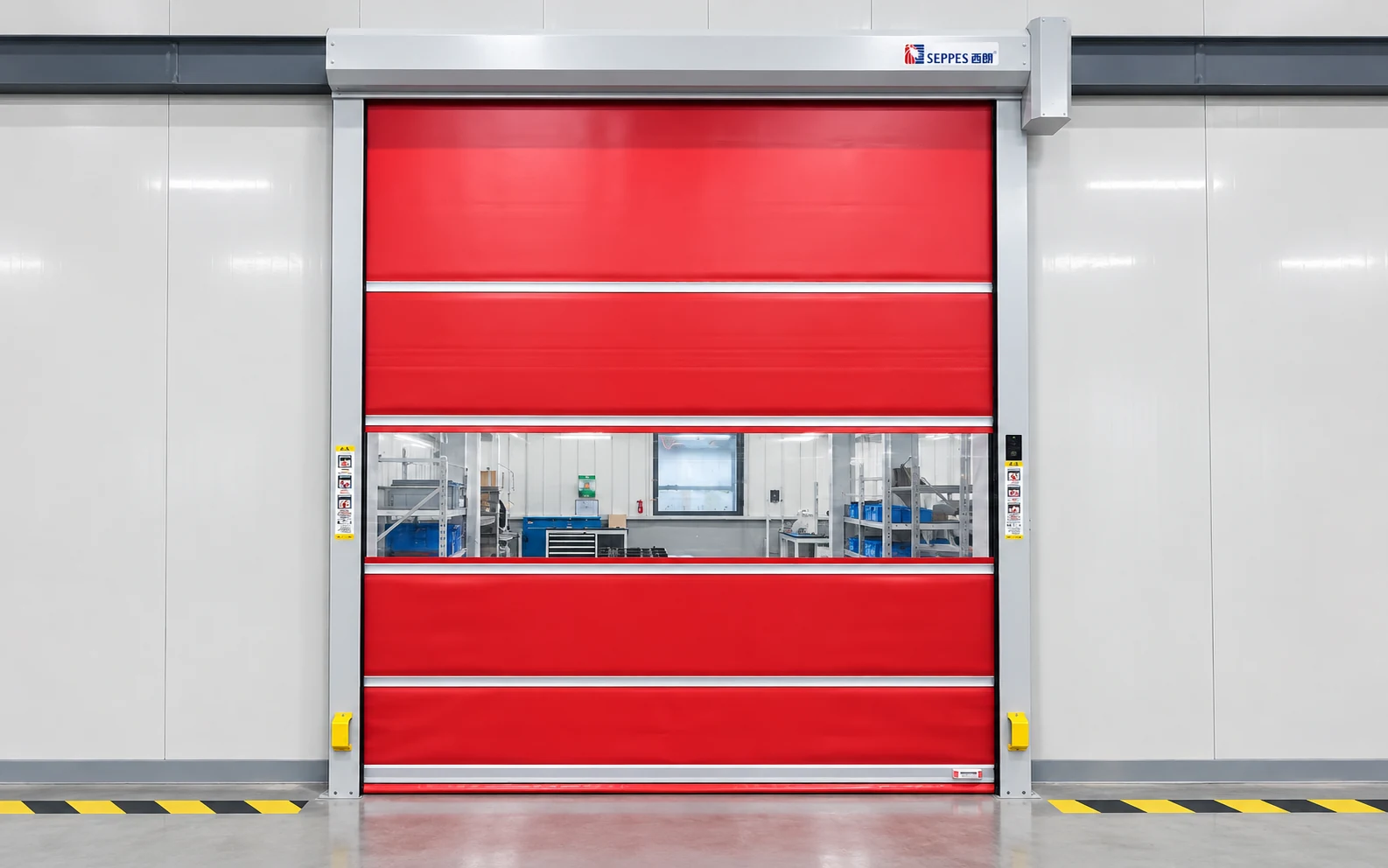 Red PVC high speed roll-up door with horizontal vision panels at an internal workshop opening